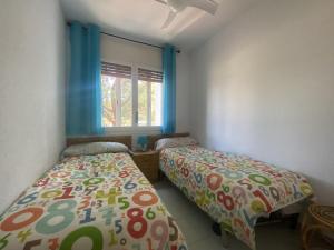 A bed or beds in a room at R121 - Apartamento Alorda park