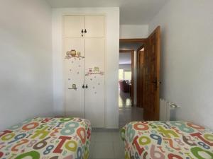 A bed or beds in a room at R121 - Apartamento Alorda park