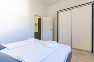 Postel nebo postele na pokoji v ubytování SUNRISE ISLAND LOFT