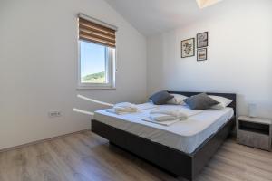 Postel nebo postele na pokoji v ubytování SUNRISE ISLAND LOFT