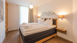 Voodi või voodid majutusasutuse Grimming Lodge by keyone toas