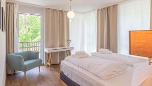 Voodi või voodid majutusasutuse Grimming Lodge by keyone toas