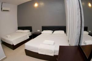 En eller flere senger på et rom på CK Hotel