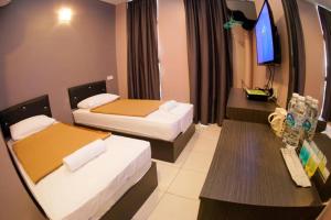 En eller flere senger på et rom på CK Hotel