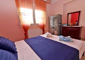Postel nebo postele na pokoji v ubytování Villa Vangelis
