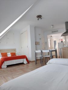 A bed or beds in a room at Ático by Alhaurín Loft City Center