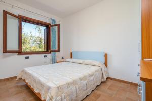 Posteľ alebo postele v izbe v ubytovaní Villetta Confortevole