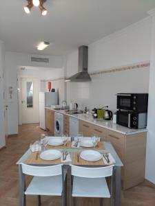 A kitchen or kitchenette at Ático by Alhaurín Loft City Center