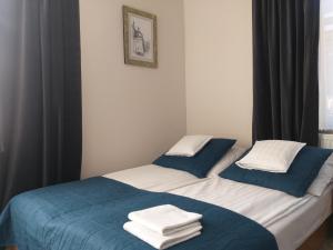A bed or beds in a room at Apartamenty i pokoje gościnne KOŁODZIEJÓWKA