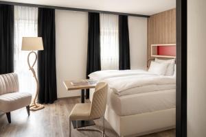 Voodi või voodid majutusasutuse Boutiquehotel Thessoni Classic & Self service Residence Home Zürich toas