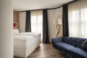 Voodi või voodid majutusasutuse Boutiquehotel Thessoni Classic & Self service Residence Home Zürich toas