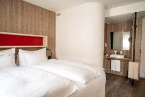 Voodi või voodid majutusasutuse Boutiquehotel Thessoni Classic & Self service Residence Home Zürich toas