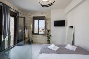 Postel nebo postele na pokoji v ubytování Stone Project Villa