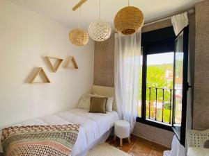 Łóżko lub łóżka w pokoju w obiekcie Apartamento Rural La Leyenda