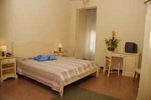 Postel nebo postele na pokoji v ubytování Hotel B&B Risorta
