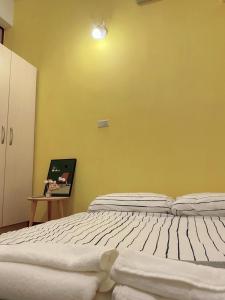 Postel nebo postele na pokoji v ubytování Wangs Hostel