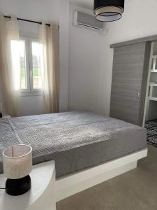 A bed or beds in a room at Voras Villa Panagia Beach