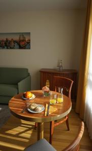 a table that has some food on it at NewLivingHome Residenzhotel Hamburg in Hamburg