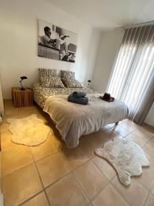 a bedroom with a large bed in a room at CLOS DE LA BELLEVUE in Villes-sur-Auzon
