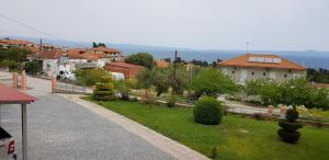 a view of a town with houses and a street at Anatolia Studios in Kriopigi