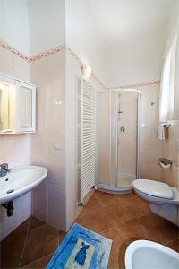 Koupelna v ubytování Hotel B&B Risorta