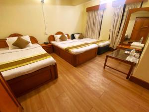 Llit o llits en una habitació de Hotel Bodhiz