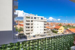 a view of a white building from a balcony at Apartment Margarita in Zadar