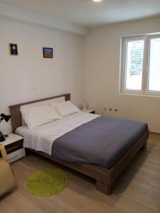 Posteľ alebo postele v izbe v ubytovaní Apartman Villa Adrijana