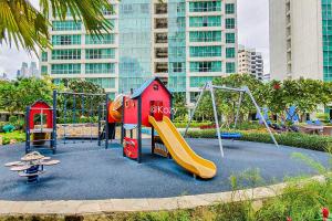 a childrens playground with a slide and a slideintend at London by Kozystay - Setiabudi in Jakarta