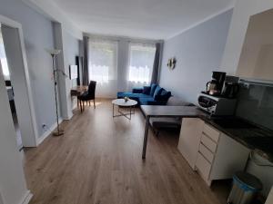 a living room filled with furniture and a kitchen at Apartment Residence - FREE PARKING in Bratislava