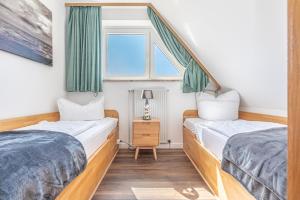 Postel nebo postele na pokoji v ubytování Meer Appartement