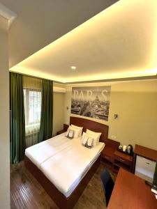 a bedroom with a large bed in a room at Your Home (YH) in Yerevan