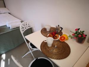 A bed or beds in a room at Marilor Apartments