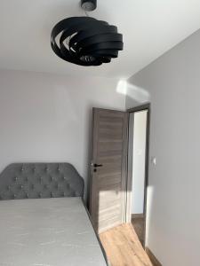 Łóżko lub łóżka w pokoju w obiekcie Apartamenty Danka