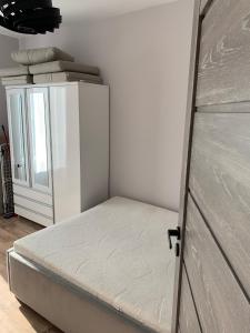 Łóżko lub łóżka w pokoju w obiekcie Apartamenty Danka