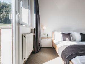 Łóżko lub łóżka w pokoju w obiekcie Haus Bellevue by VAYA inklusive Super Sommer Card
