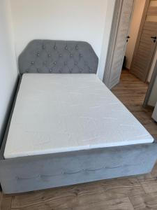 Łóżko lub łóżka w pokoju w obiekcie Apartamenty Danka