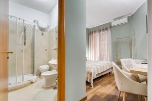 Koupelna v ubytování JMartins Roma Suites + 90 fotografií