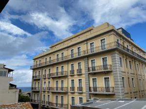 a large building with balconies on top of it at Kentia Modern/Artistic City Apartment in Heraklio Town