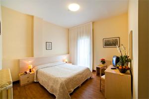 Postel nebo postele na pokoji v ubytování Hotel B&B Risorta