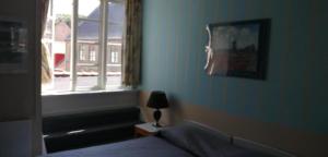 Letto o letti in una camera di Det Gamle Hotel Rudkøbing