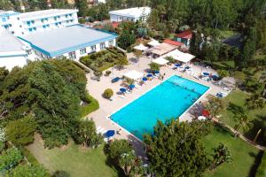 an aerial view of a resort with a swimming pool at Apulia Hotel Forte Club Scalea in Scalea