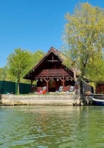 a house on the shore of a river at Casa Agapie in Uzlina