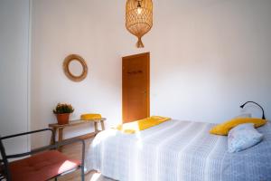 Posteľ alebo postele v izbe v ubytovaní Attico Via Capo Soprano