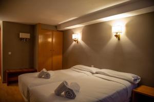 Postel nebo postele na pokoji v ubytování Pic Maià Mountain Hotel
