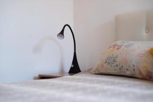 Posteľ alebo postele v izbe v ubytovaní Attico Via Capo Soprano