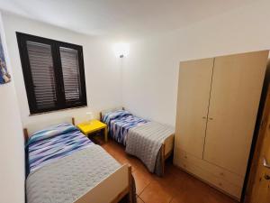 Letto o letti in una camera di Casa Carolina