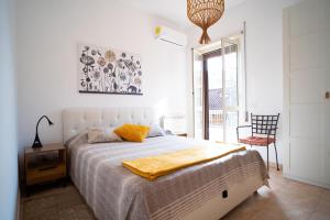 Posteľ alebo postele v izbe v ubytovaní Attico Via Capo Soprano