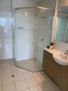 a bathroom with a glass shower and a sink at Apartment 3 Wallaroo Marina in Wallaroo