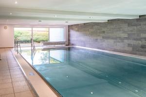 a swimming pool in a house at Alpenblume in Fischen